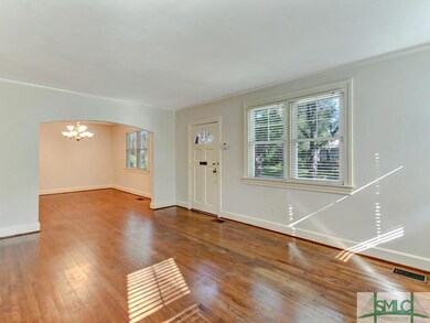 Large, bright living room looking into the formal 