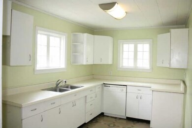Look at all of the cabinetry in this bright, cheery kitchen!