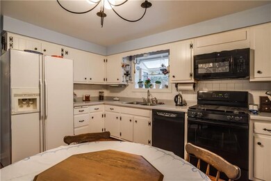THE EAT IN KITCHEN IS 12'x11' AND THE GAS STOVE WA