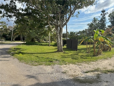 View of property's community with a lawn