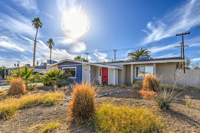 Single story home with fence