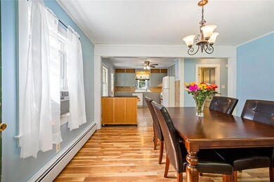The dining room and kitchen as you...