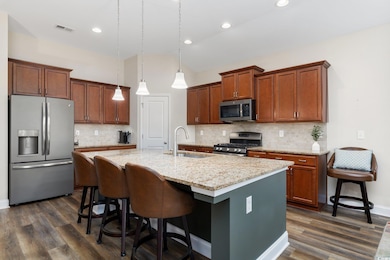 Kitchen with a sink, stainless steel appliances, d