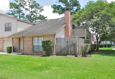 FRONT OF THE HOUSE WITH SIDE YARD AND PATIO