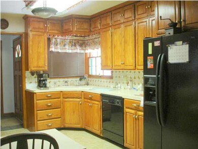 Good counter space and beautiful oak cabinets are 