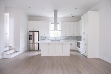 Modern kitchen with open floor plan to living room