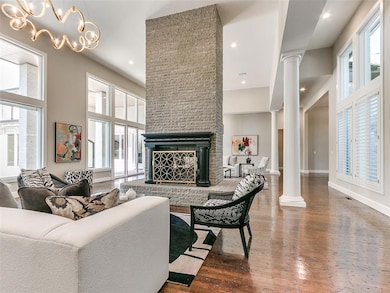 This great room boasts a double-sided fireplace an
