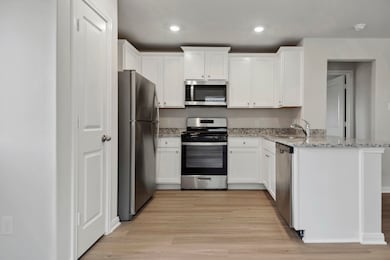 The kitchen is upgraded with Whirlpool appliances