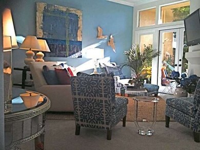 Formal Living room with lots of sunlight through t