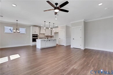 Photo represents the plan, not the actual home. Design selections may vary. A spacious family room with gas fireplace.
