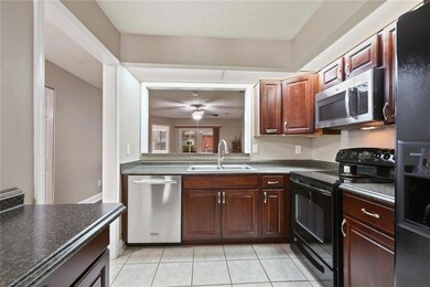 Spacious kitchen over looking living room! Applian