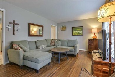 Spacious living room with large windows letting in