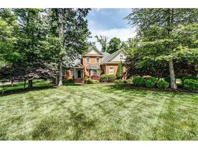 Beautifully landscaped with lush lawns, mature pla