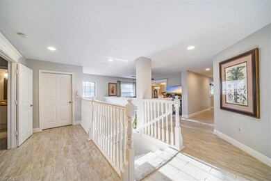 Hallway with recessed lighting, baseboards, light 