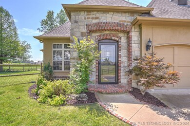 Nicely landscaped with stucco and stone exterior.