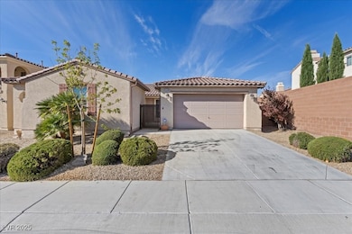 Mediterranean / spanish house featuring a tile roof, stucco siding, concrete driveway, and 3 car attached tandem garage.