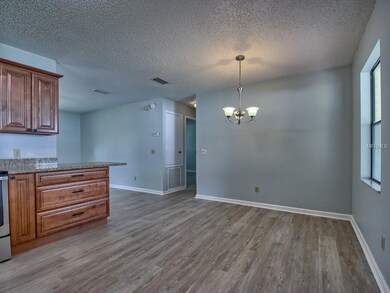 View of OPEN KITCHEN (front L), DINING ROOM (R), &