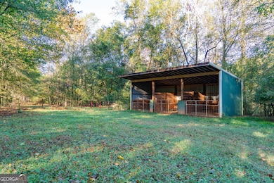 3 stall shed row style barn with large stalls.