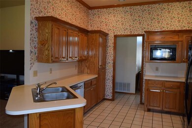 Kitchen - Breakfast bar, disposal, dishwasher, microwave & gas stove