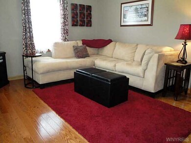 Living Room Gleaming Hardwood Floors are Featured 
