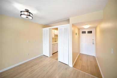 Kitchen entrance left, and front door on right