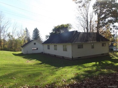 side and back view of house and garage
