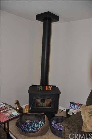 Cozy wood stove in living room.  