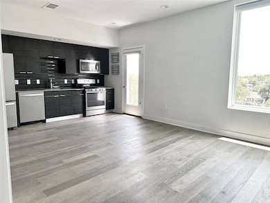 Kitchen featuring appliances with stainless steel