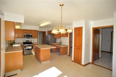 Pantry, stainless appliances and island with space