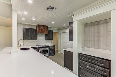 Kitchen featuring stainless steel range with elec
