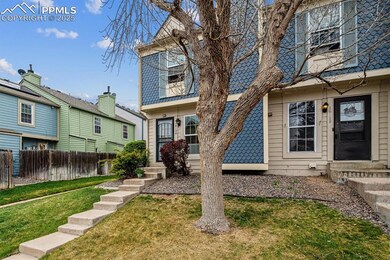 View of front of property with fence, a front yard, and entry steps