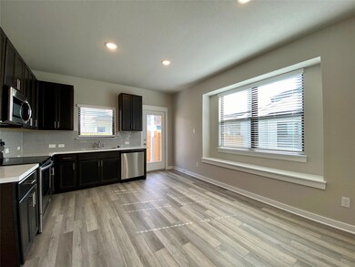 Kitchen featuring appliances with stainless steel