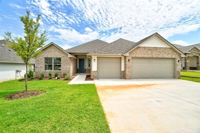 View of front of property with a garage and a fron