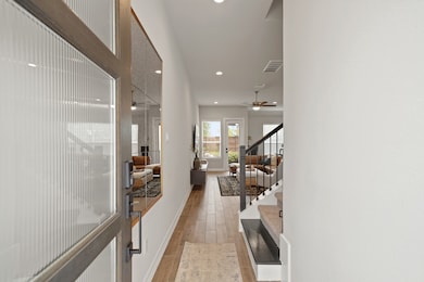 Featuring hardwood tile floors throughout the home