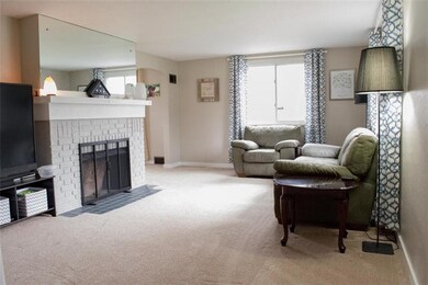 LIGHT & BRIGHT LIVING ROOM WITH WOOD BURNING FIREP
