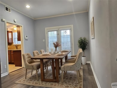 Virtually staged. The dining room is conveniently situated next to the kitchen, making meal preparation and serving seamless and efficient. The space opens directly to the living room, creating an inviting environment that is ideal for hosting gatherings and socializing with family and friends.