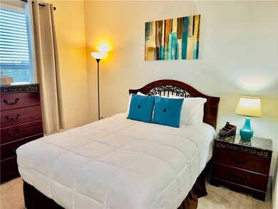 Bedroom with light carpet