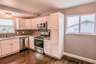 Stylish kitchen with custom cabinets, stainless st