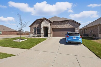 French provincial home featuring concrete driveway