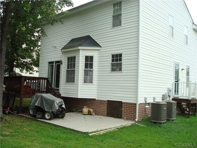 Rear of House with concrete patio and rear Deck!