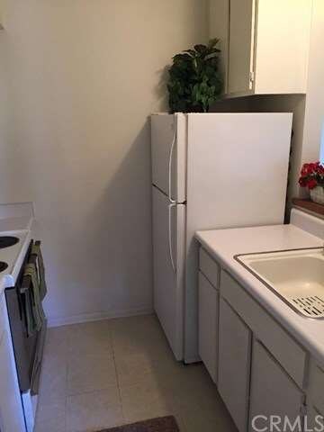 Nice kitchen with plenty of cabinetry and a pantry