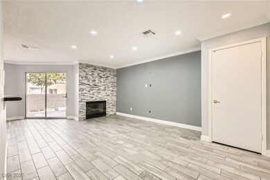 Unfurnished living room with crown molding, basebo