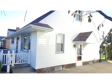 Side view of the home with a covered porch.