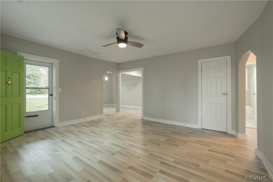 Empty room with light hardwood / wood-style floors
