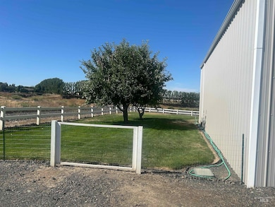 View of yard with a view of rural / pastoral area