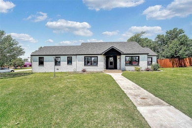 View of front of house with roof with shingles and