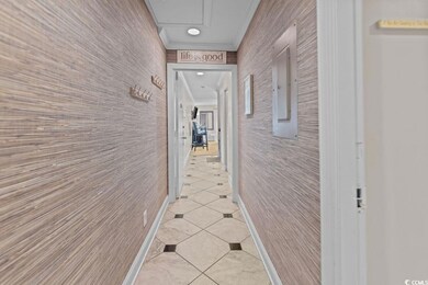 Corridor with ornamental molding and light tile pa
