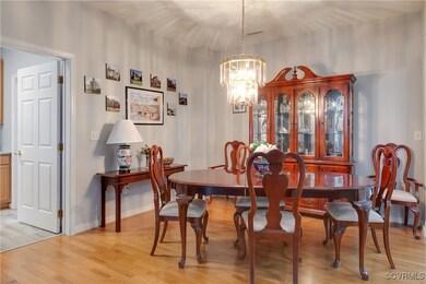 Dining Room with Laminate Floors and Chandelier.