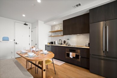 Kitchen with stainless steel appliances, open she