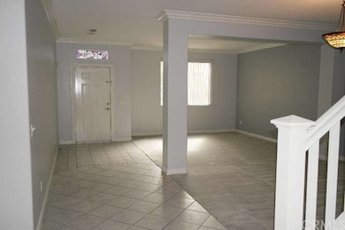 Airy formal living room and dining room off the fr